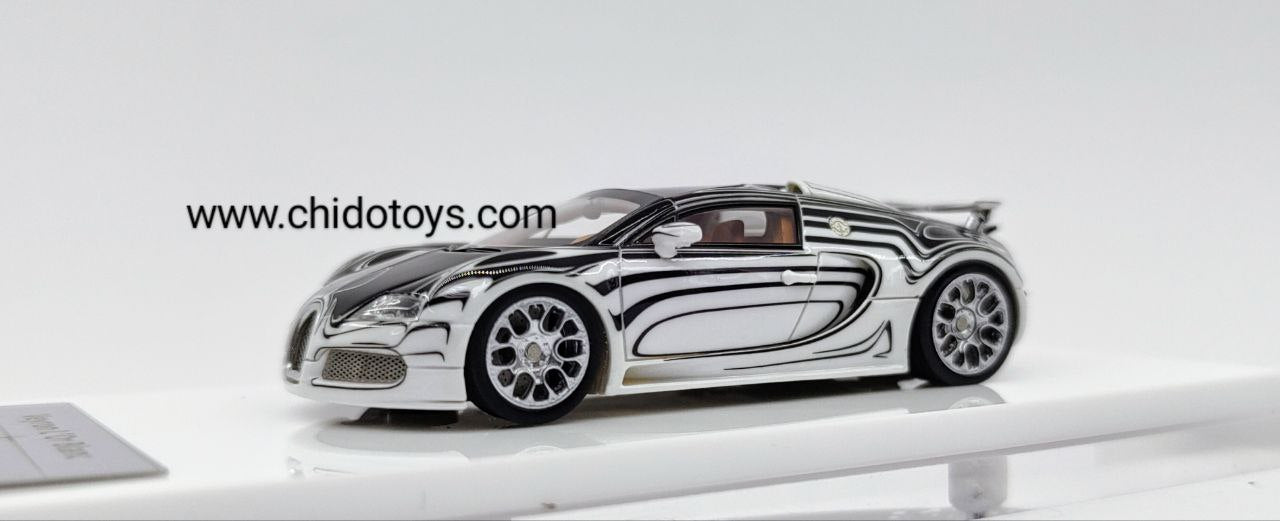 Bugatti Veyron L’Or Blanc LJM 1:64 en resina blanca y negra con efecto glow azul, llantas de goma y capelo acrílico