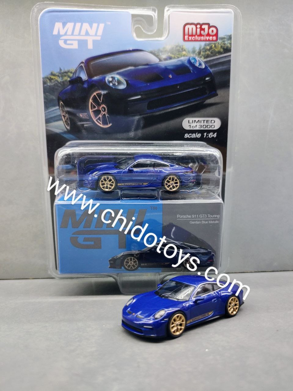 Auto a escala marca Mini GT Porsche 911 (992) GT3 Touring (azul genciana metalizado) - Chido Toys