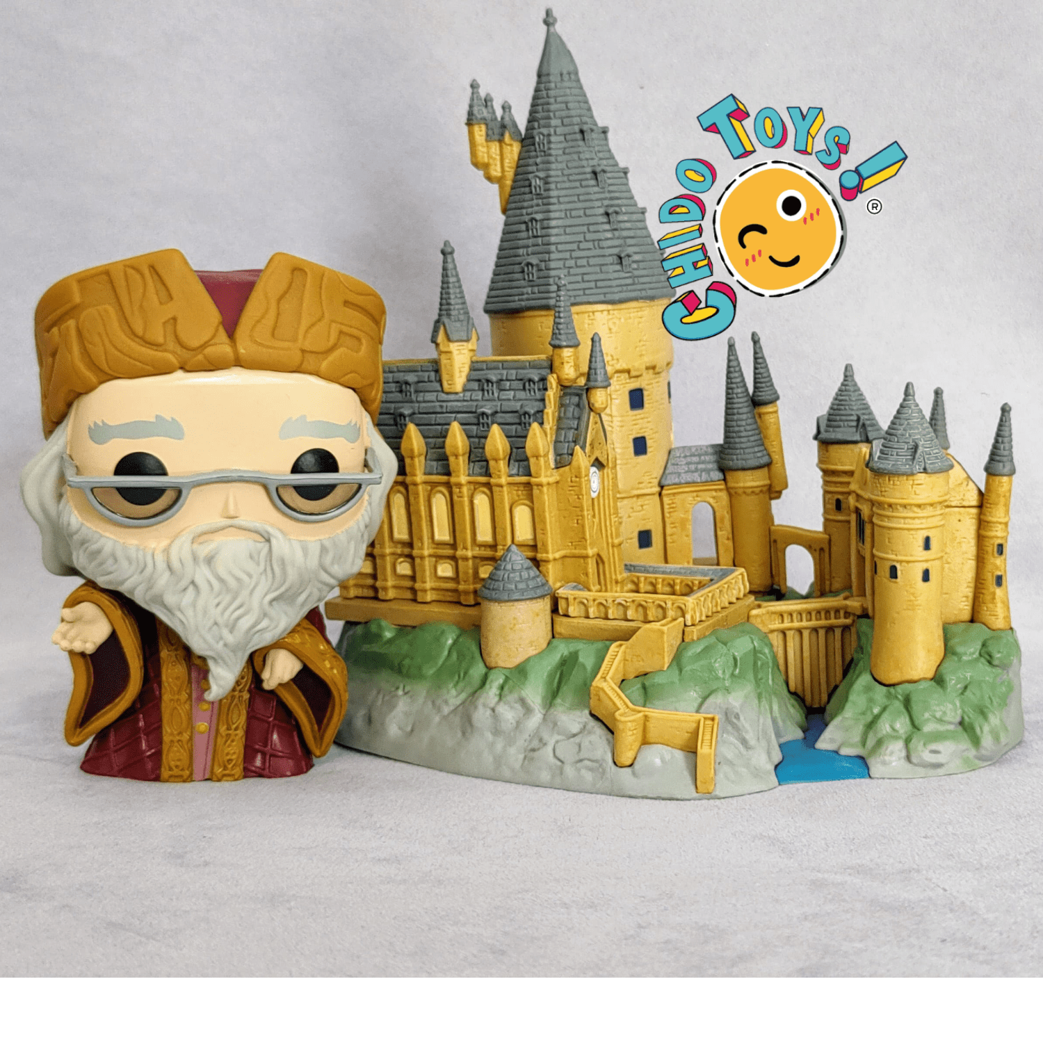 Figuras de vinyl, marca Funko, modelo Albus Dumbledore with Hogwarts - Chido Toys