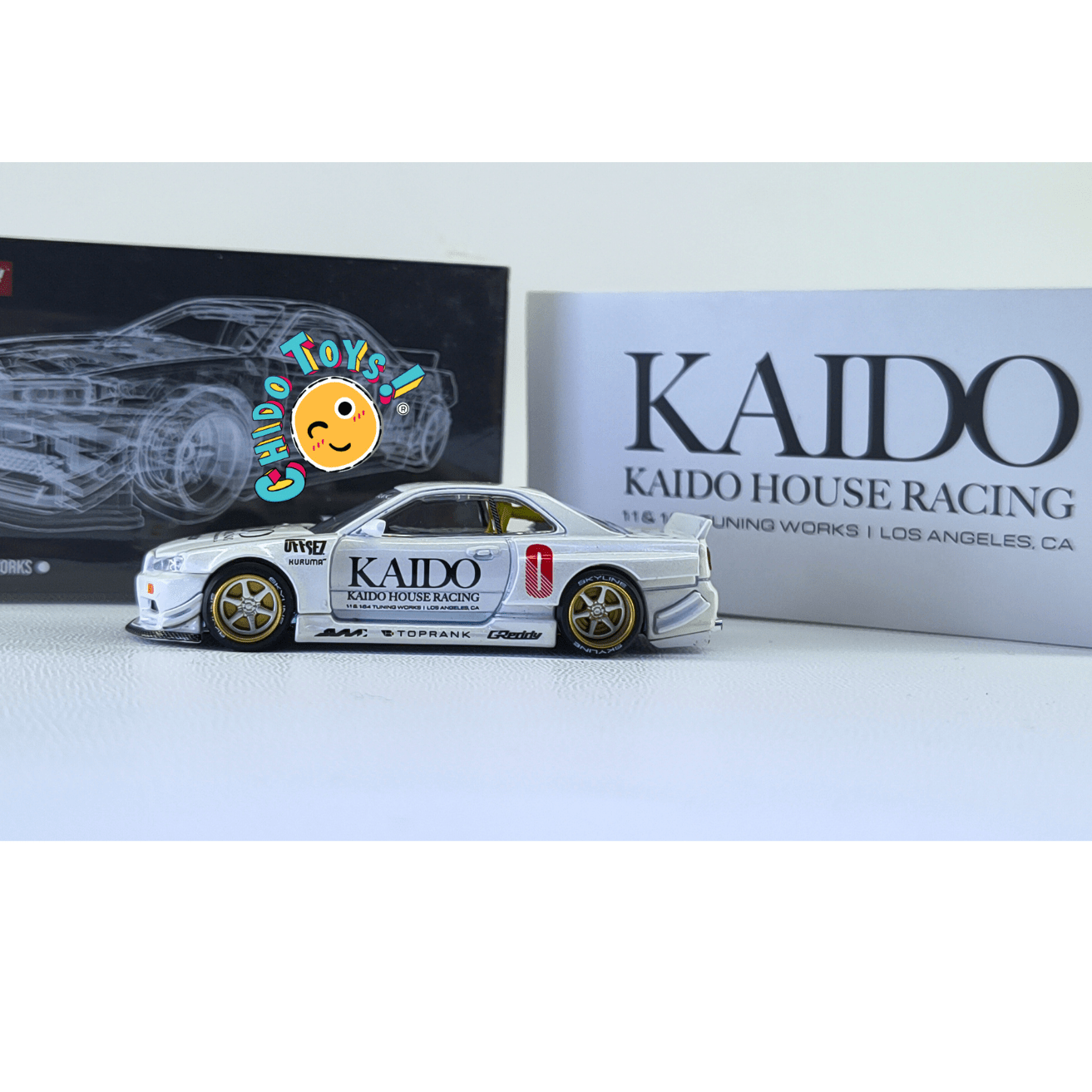 Kaido House 049 Nissan Skyline GT - R R34 White CHASE 1:64 | Cofre Abierto | Metal - Chido Toys