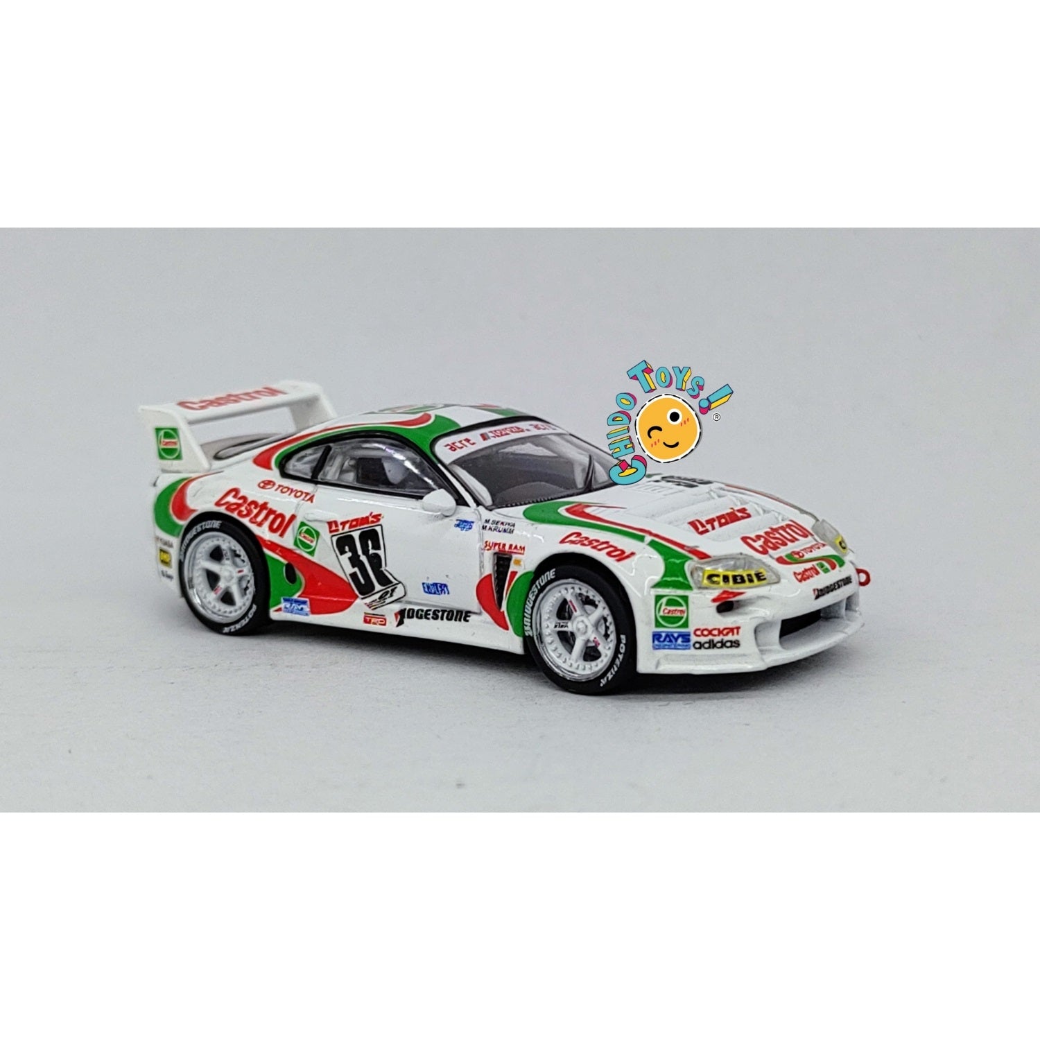 Auto a escala marca Tarmac Works, Modelo Toyota Supra GT JGTC 1995 M. Sekiya / M. Krumm con embalaje de camión