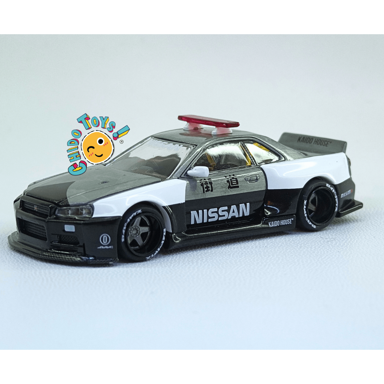 Nissan Skyline GT - R R34 Kaido Works V2 Aero Japan Police – Versión CHASE | Mini GT x Kaido House | 1:64 - Chido Toys