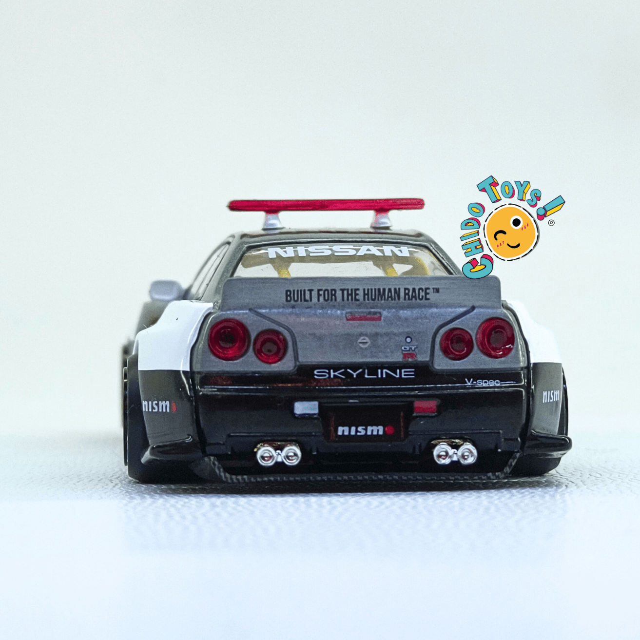 Nissan Skyline GT - R R34 Kaido Works V2 Aero Japan Police – Versión CHASE | Mini GT x Kaido House | 1:64 - Chido Toys