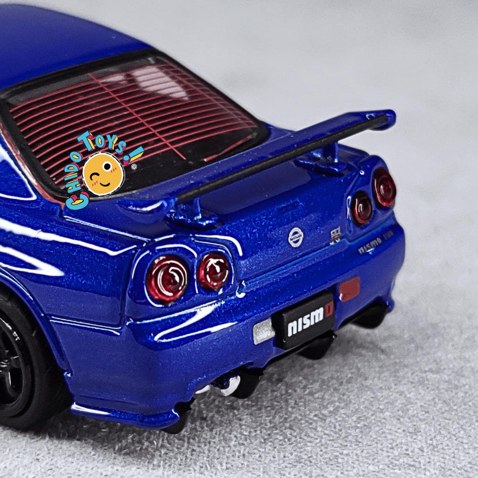 Nissan Skyline GT - R R34 Z - Tune 1/64 - Top Art - Chido Toys