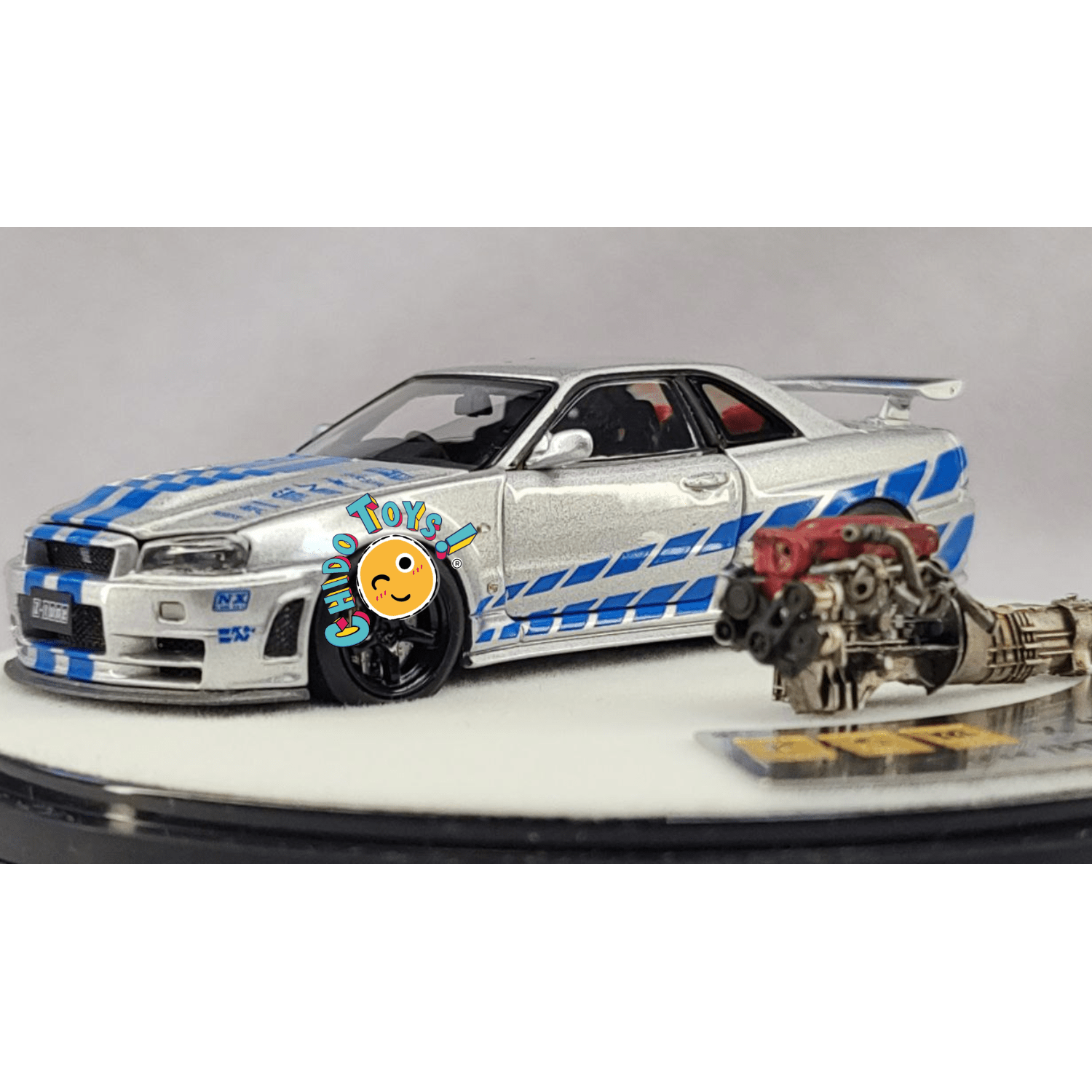 Nissan Skyline GT - R R34 Z - Tune Silver Blue Stripe – PGM 1:64 - Chido Toys