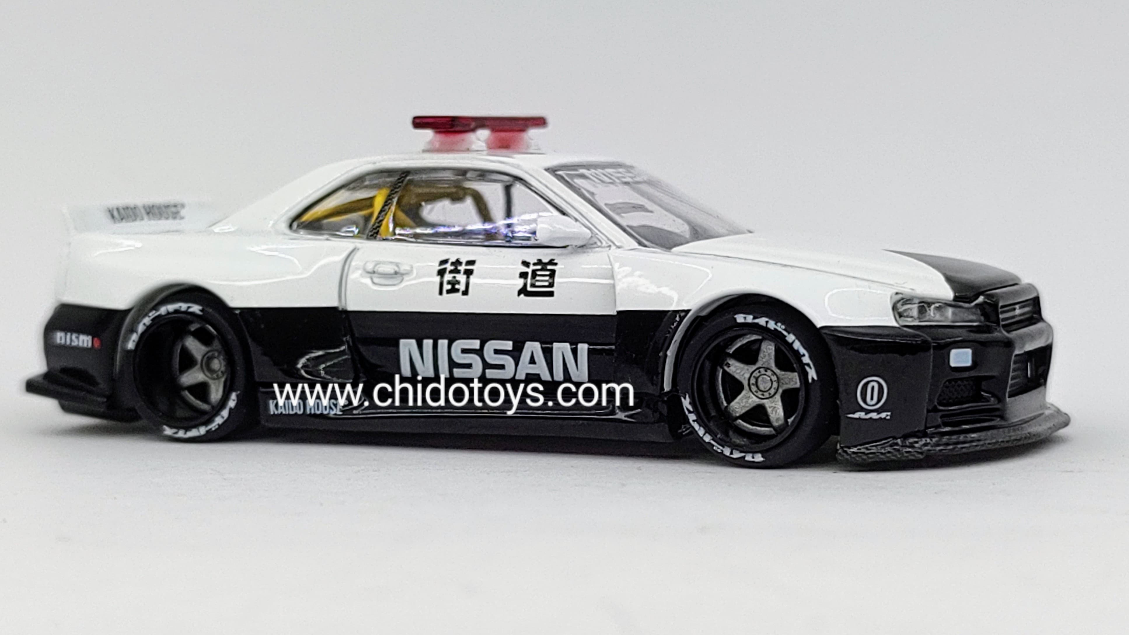 Patrulla a escala marca Kaido House, Modelo Nissan Skyline GT - R (R34) V2 AERO (JAPAN POLICE) - Chido Toys