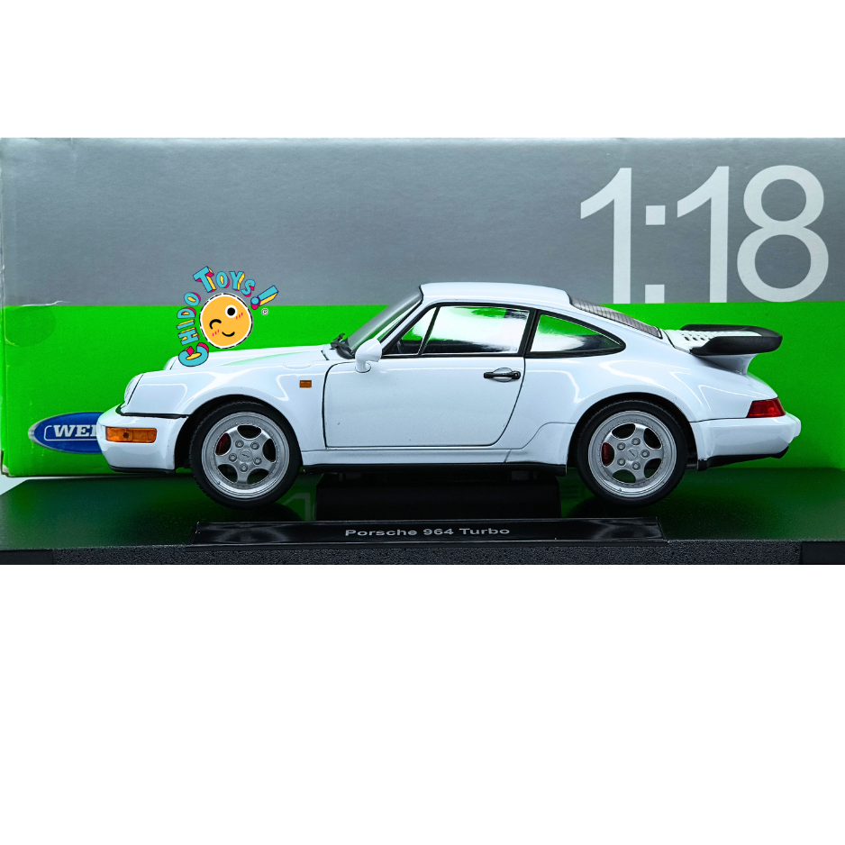 Welly Porsche 964 Turbo 1990 escala 1:18 color blanco con carrocería de metal, llantas de goma y aperturas de puertas, cofre y motor.