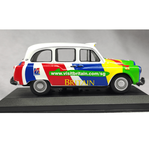 Taxi LTI FX4 Singapore 2000 a Escala 1:43 | Cuerpo de Metal | Base de Exhibición | Visit Britain Edition - Chido Toys