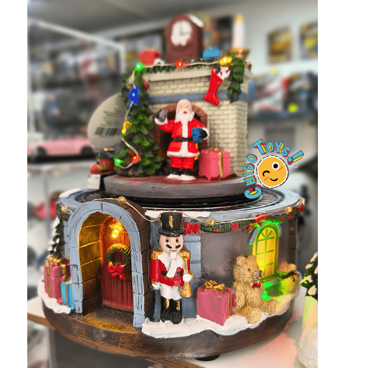 Villa navideña con tren — Luz LED y música (USB) 16×18 cm - Chido Toys