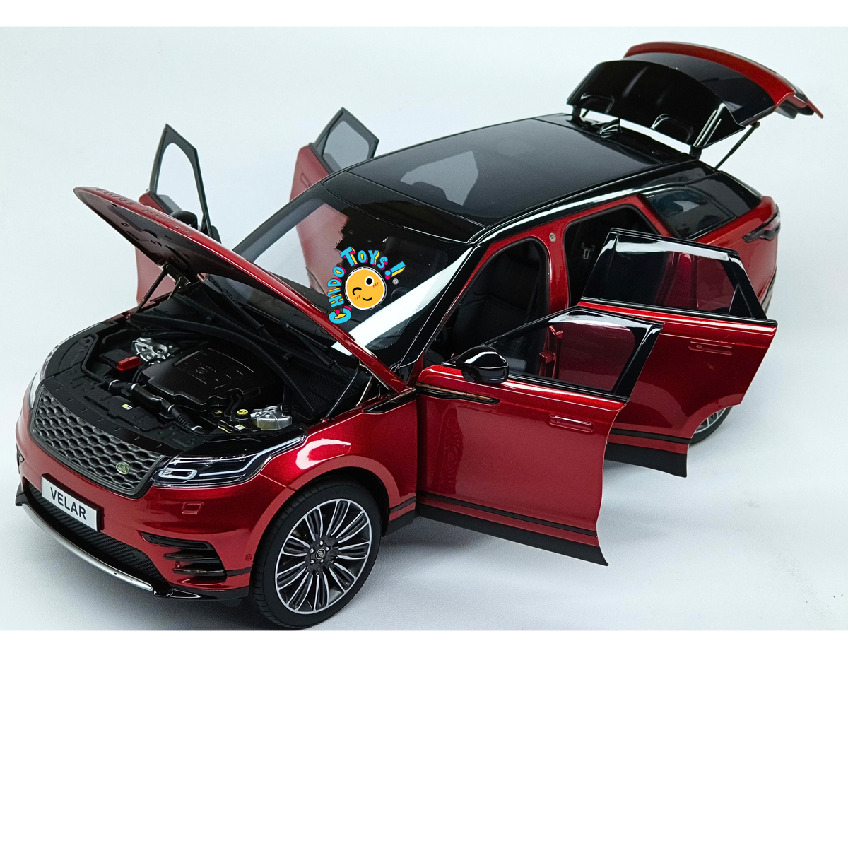 Range Rover Velar First Edition LCD Models 1:18 rojo metálico con apertura total