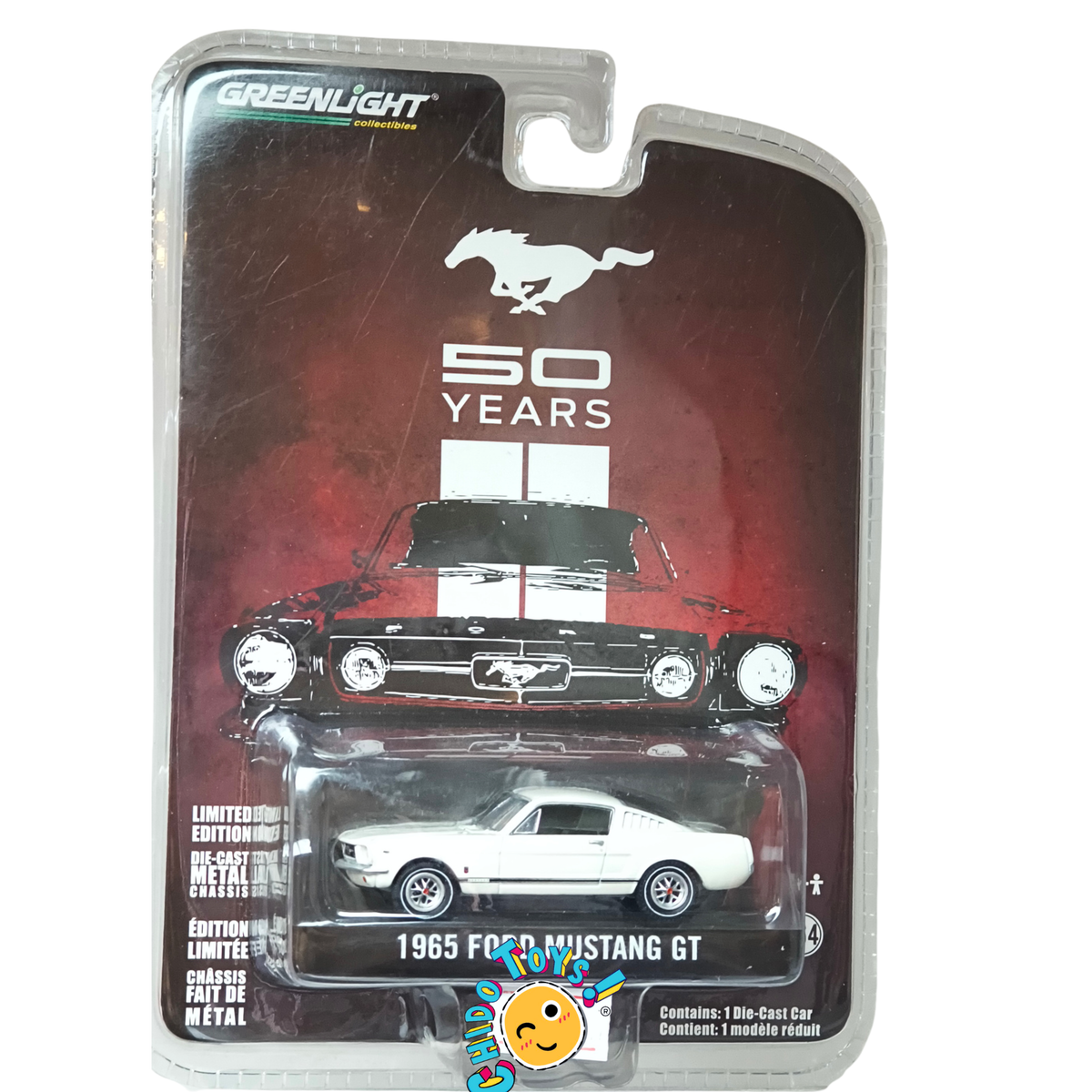 GreenLight Ford Mustang GT 1965 1:64 blanco, edición 50 Years de 2014 con chasis metálico, llantas de goma y rines clásicos.