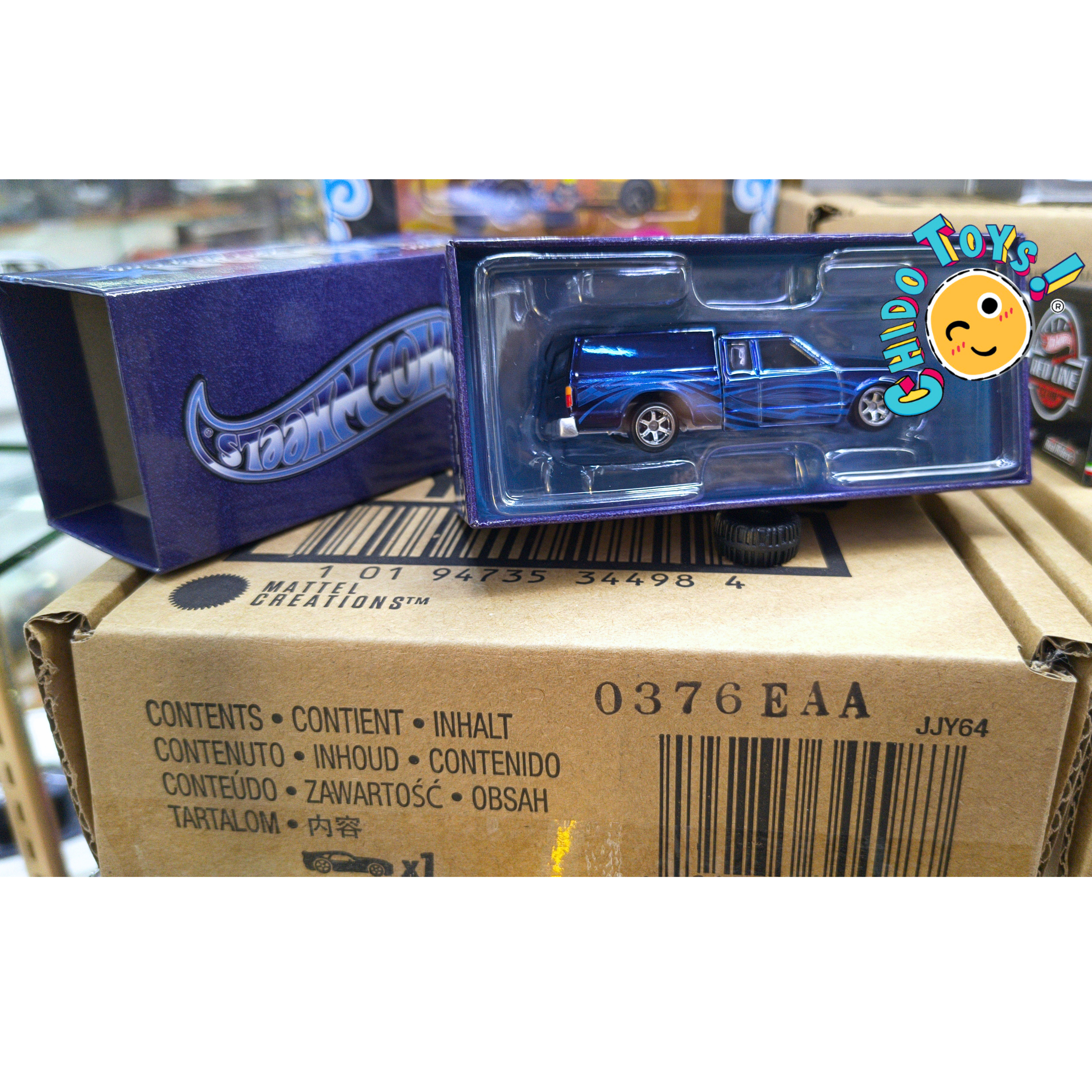 Hot Wheels RLC 1986 Nissan 720 King Cab 1:64 Spectraflame Steel Blue con caja articulada