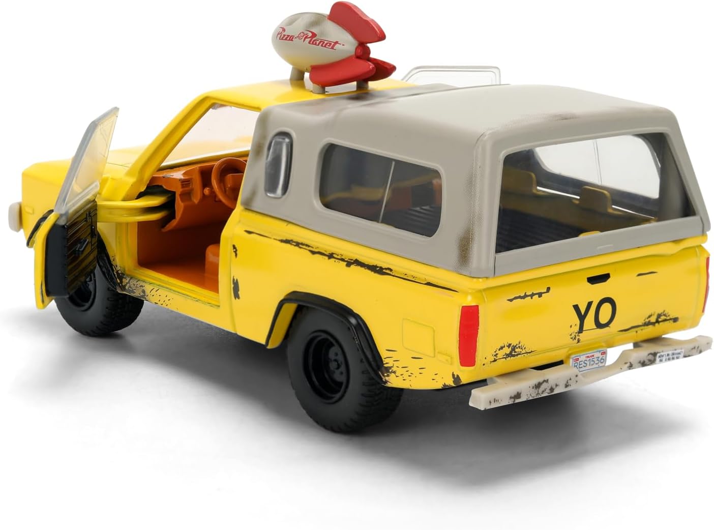 Jada Toys Pizza Planet Truck 1:32 amarilla con apertura de puertas