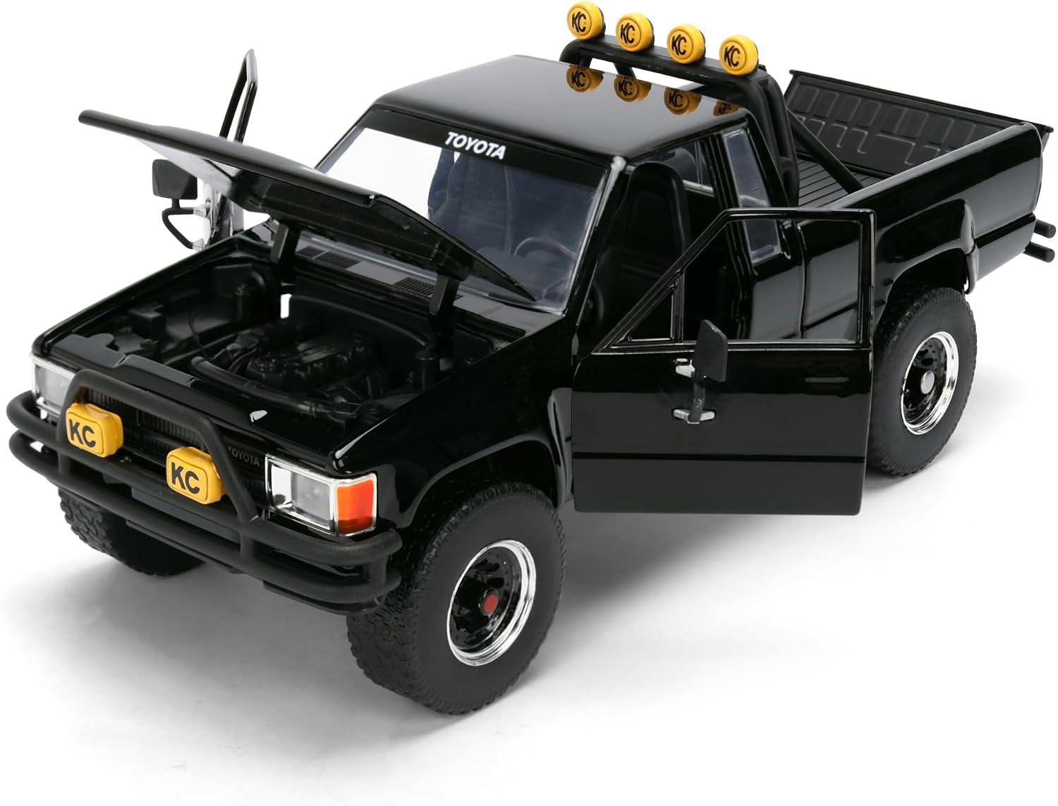 Jada Hollywood Rides Toyota SR5 Pickup 1985 1:24 negra con skateboard