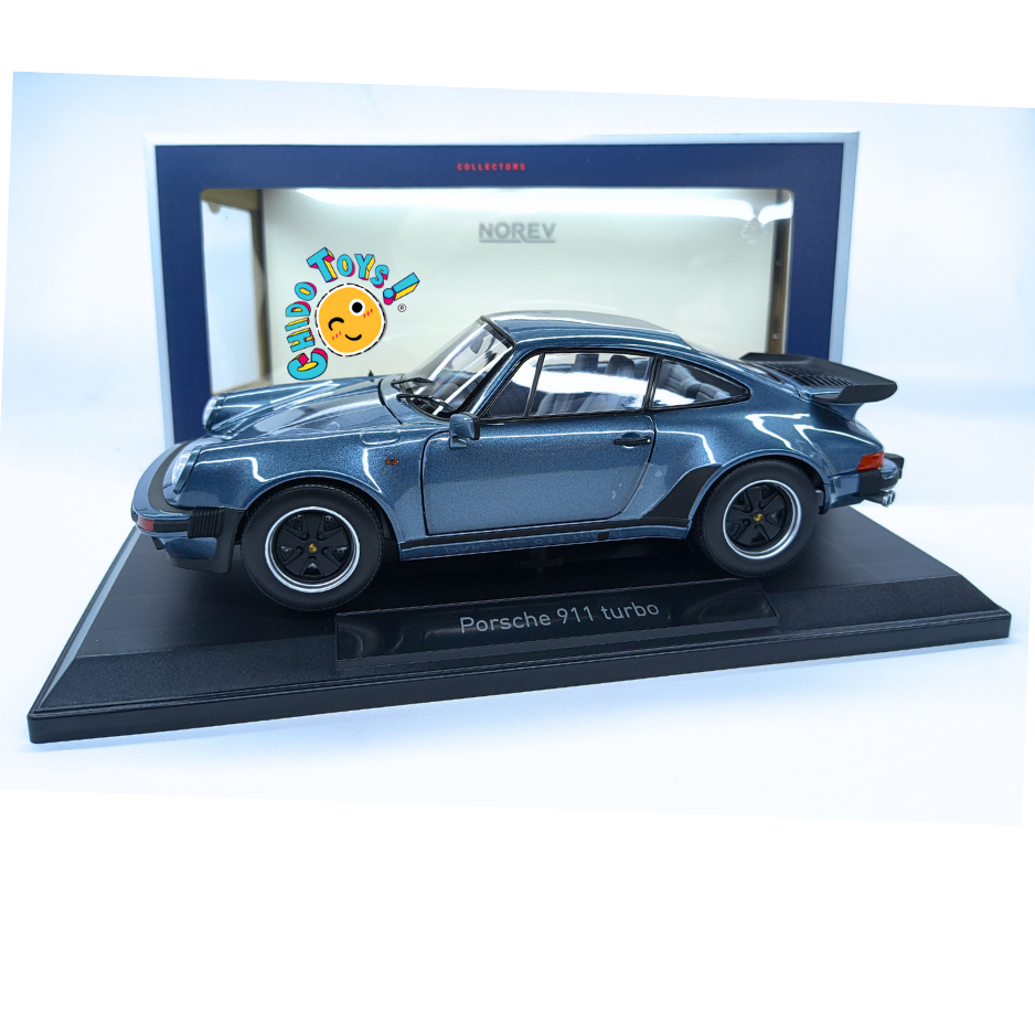 Norev Porsche 911 Turbo 930 1987 1:18 azul metálico, con apertura total, llantas de goma y base de exhibición.