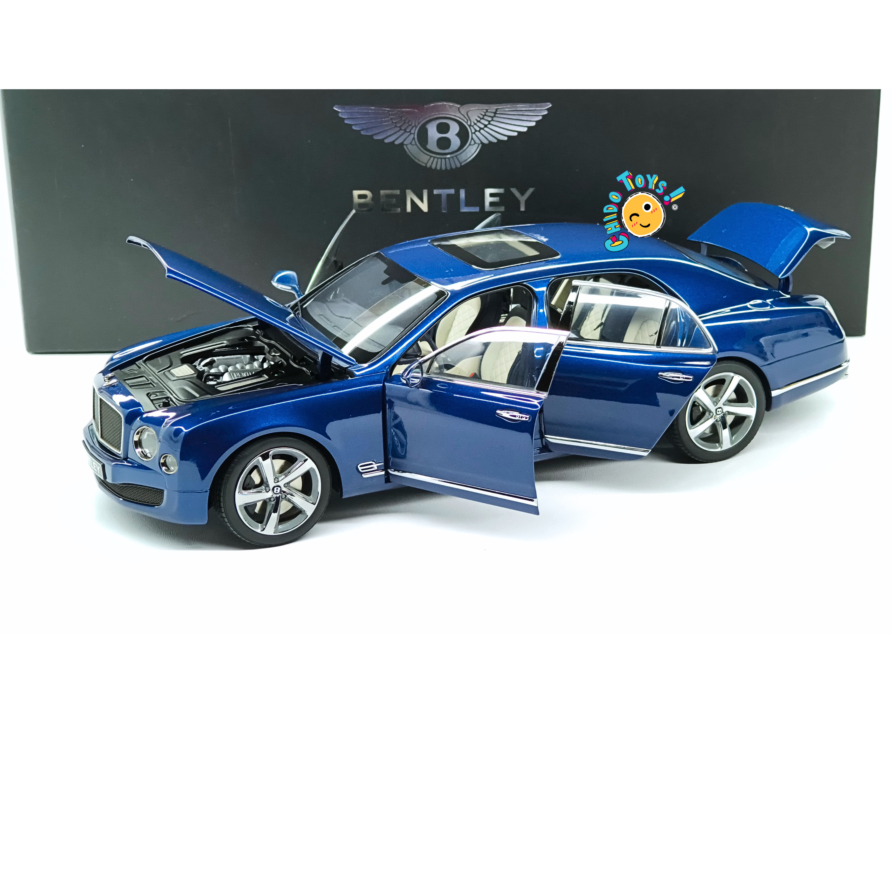 Kyosho Bentley Mulsanne Speed 2014 1:18 Marlin Blue, diecast con apertura total, dirección funcional y caja Bentley original.