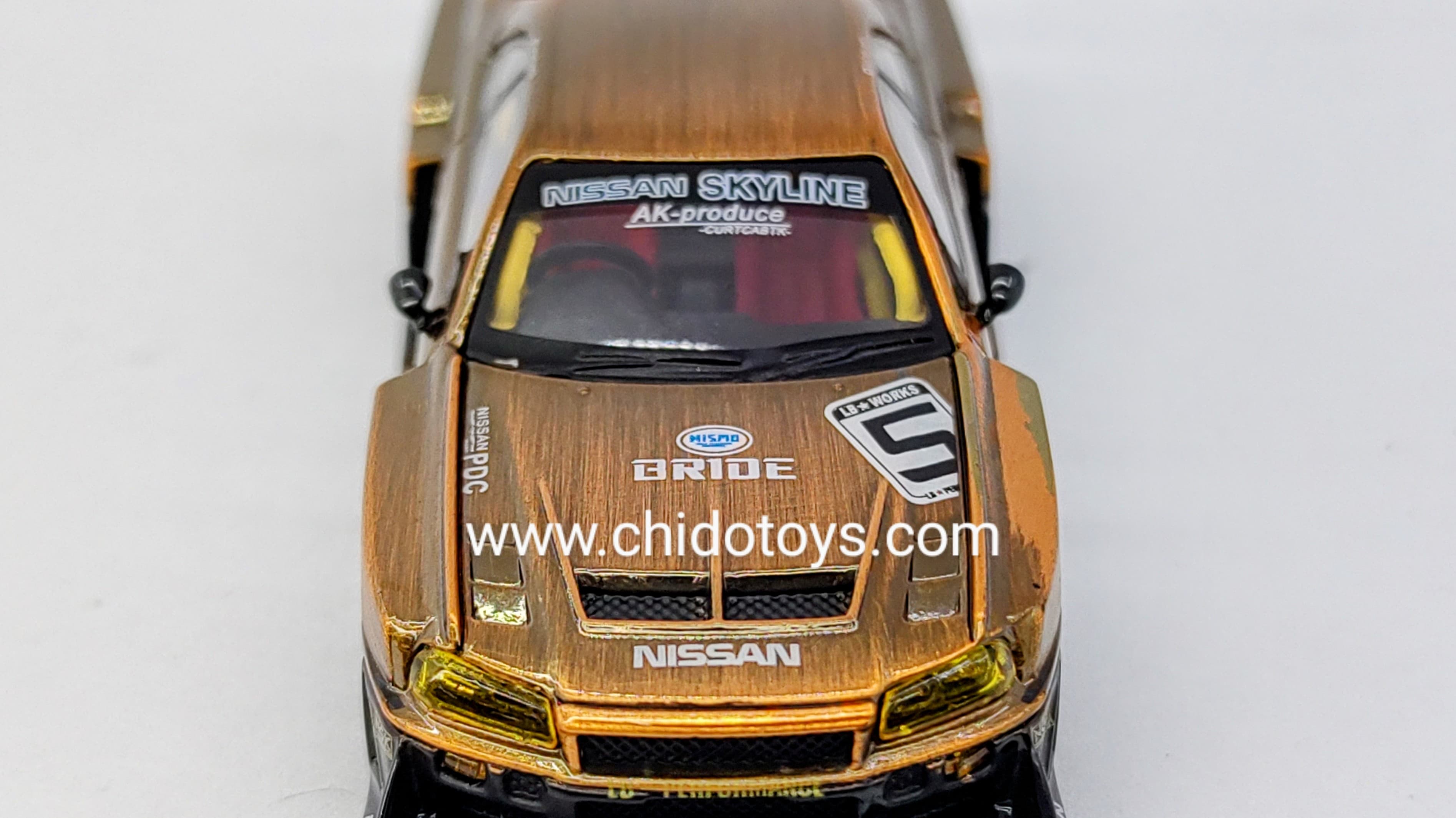 Auto a escala marca CM Model, Modelo LB - ER34 Super Silhouette Nissan Skyline Bronze - Chido Toys