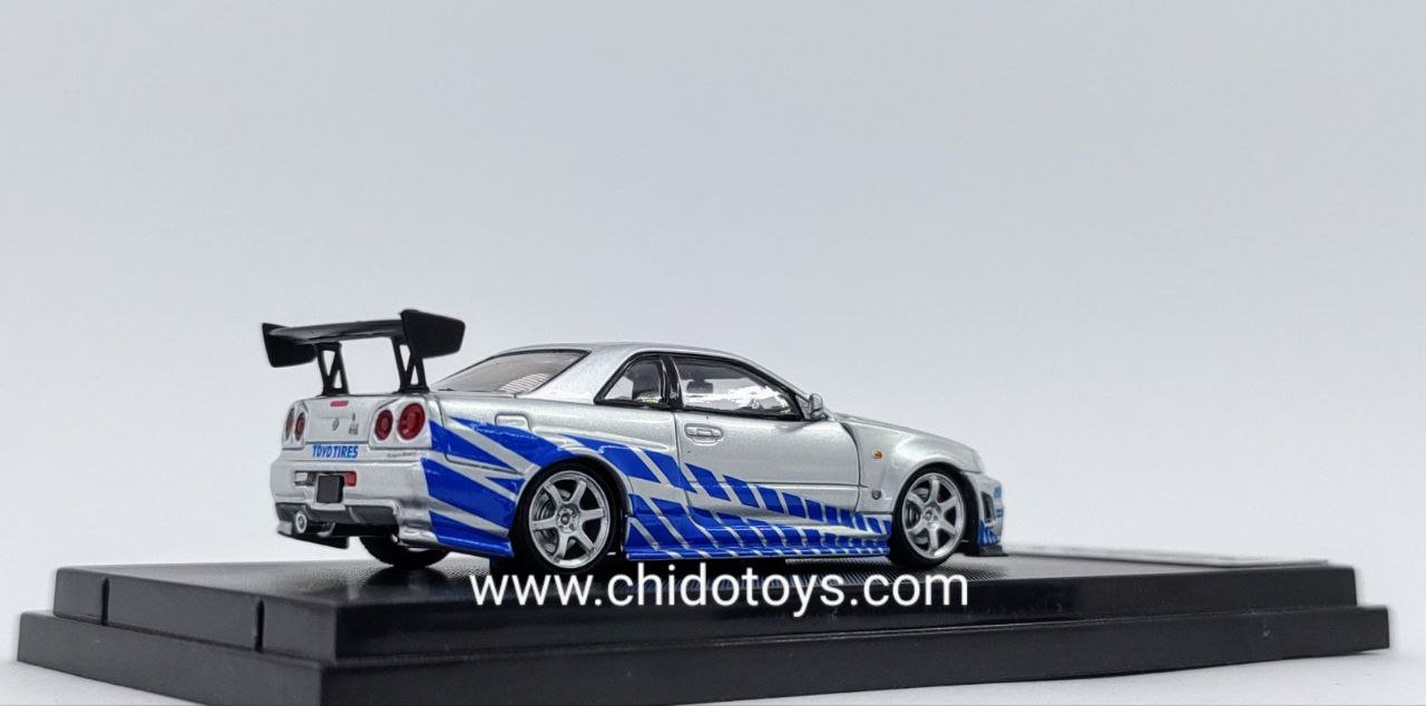 Auto a escala marca Fast Speed modelo Skyline GT - R R - 34 plata - azul - Chido Toys