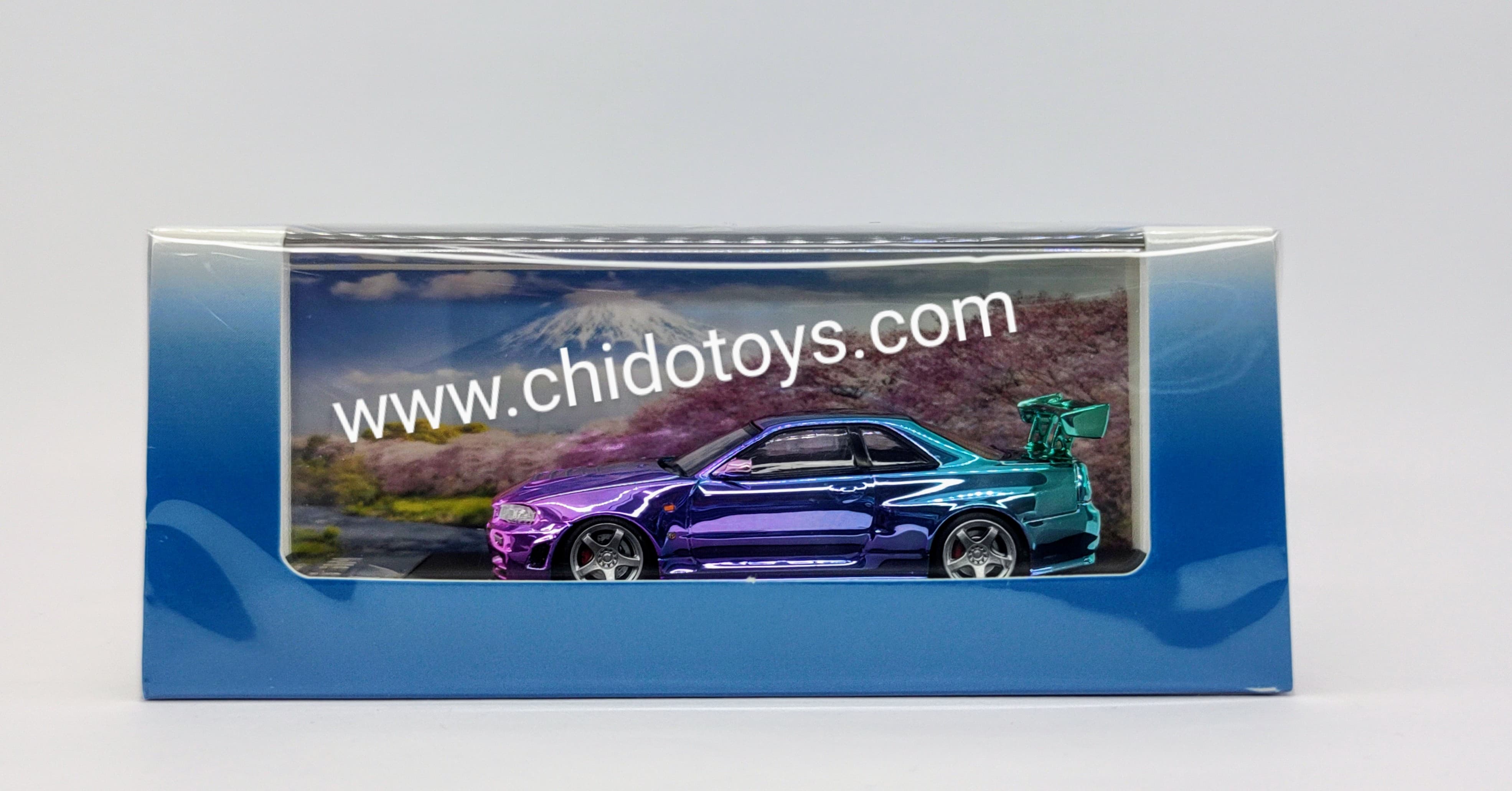 Auto a escala marca Fuji, Modelo Skyline GT - R R34 Nismo Z - Tune High Wing Purple - Blue Gradient - Chido Toys