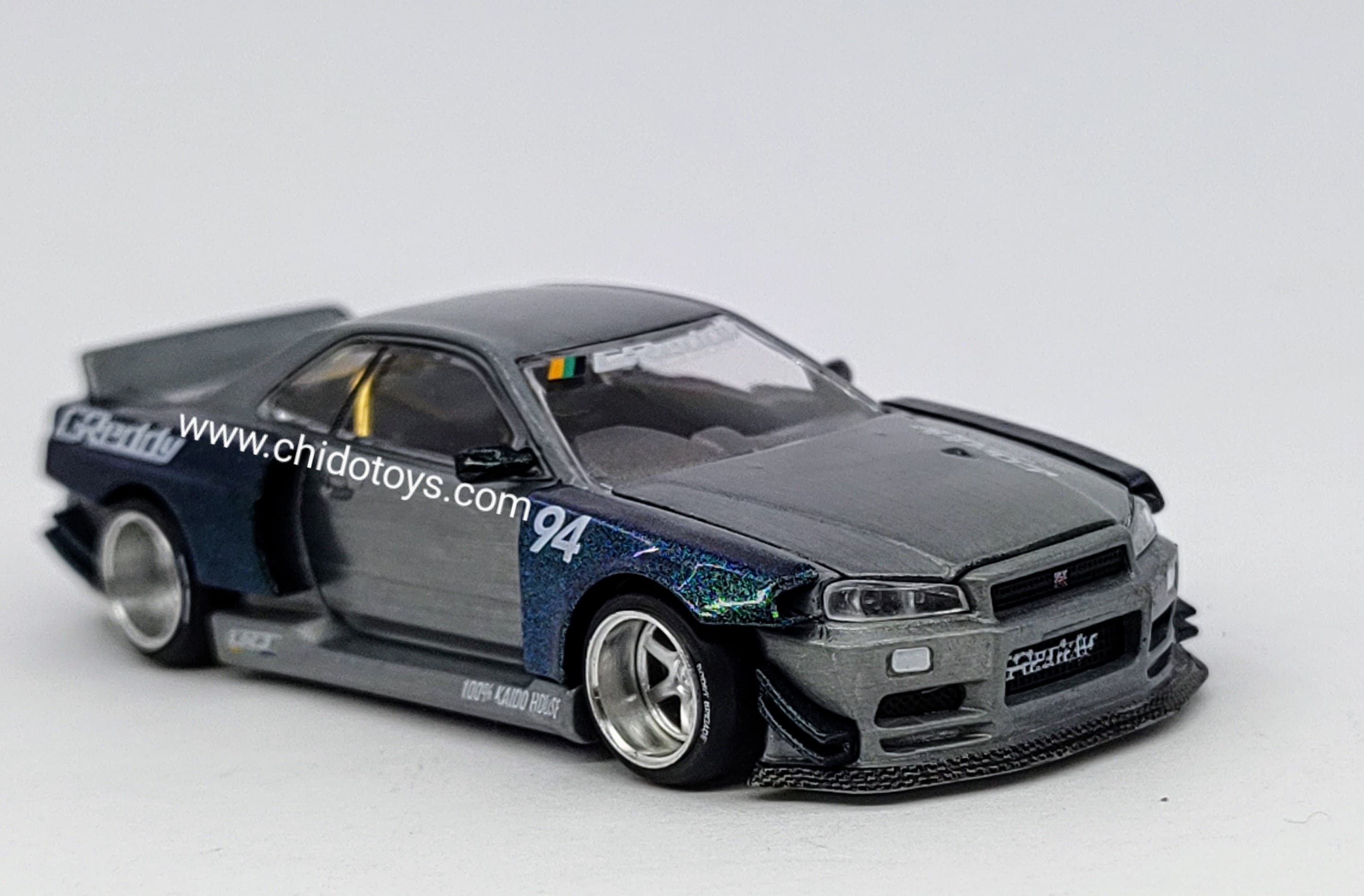 Auto a escala marca Kaido House, CHASE Skyline GT - R R34 - Chido Toys