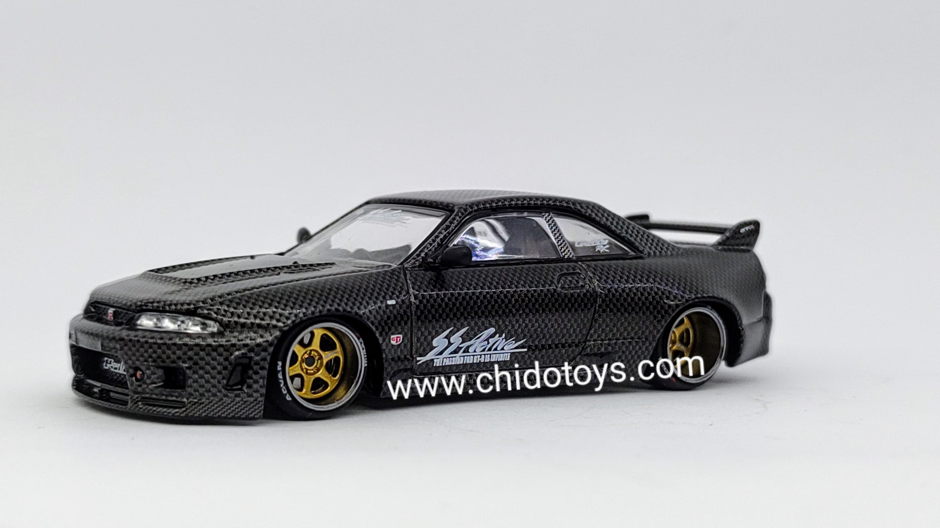 Auto a escala marca Kaido House, Modelo Nissan Skyline GT - R (R33) Active Carbon V1 - Chido Toys