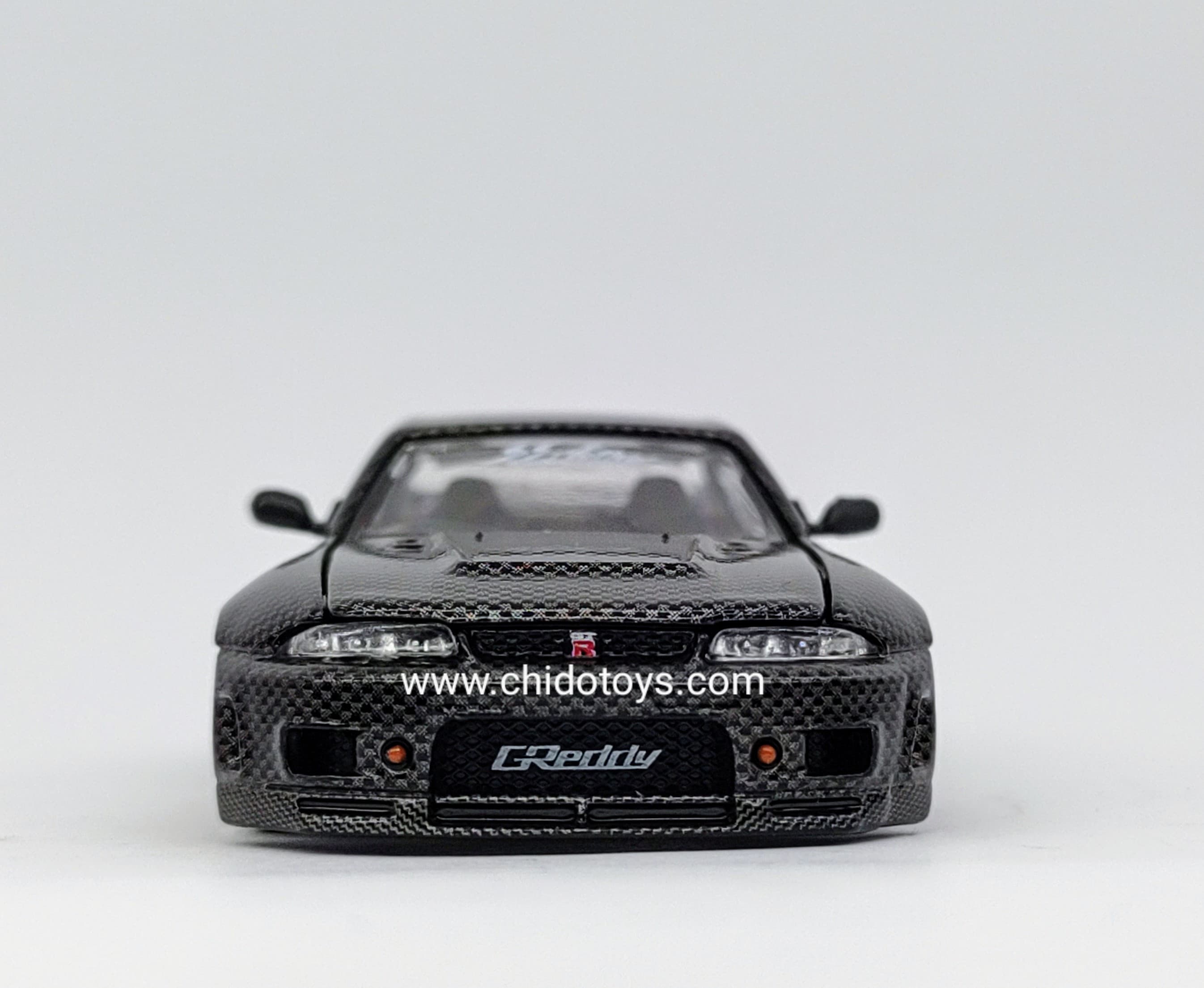 Auto a escala marca Kaido House, Modelo Nissan Skyline GT - R (R33) Active Carbon V1 - Chido Toys