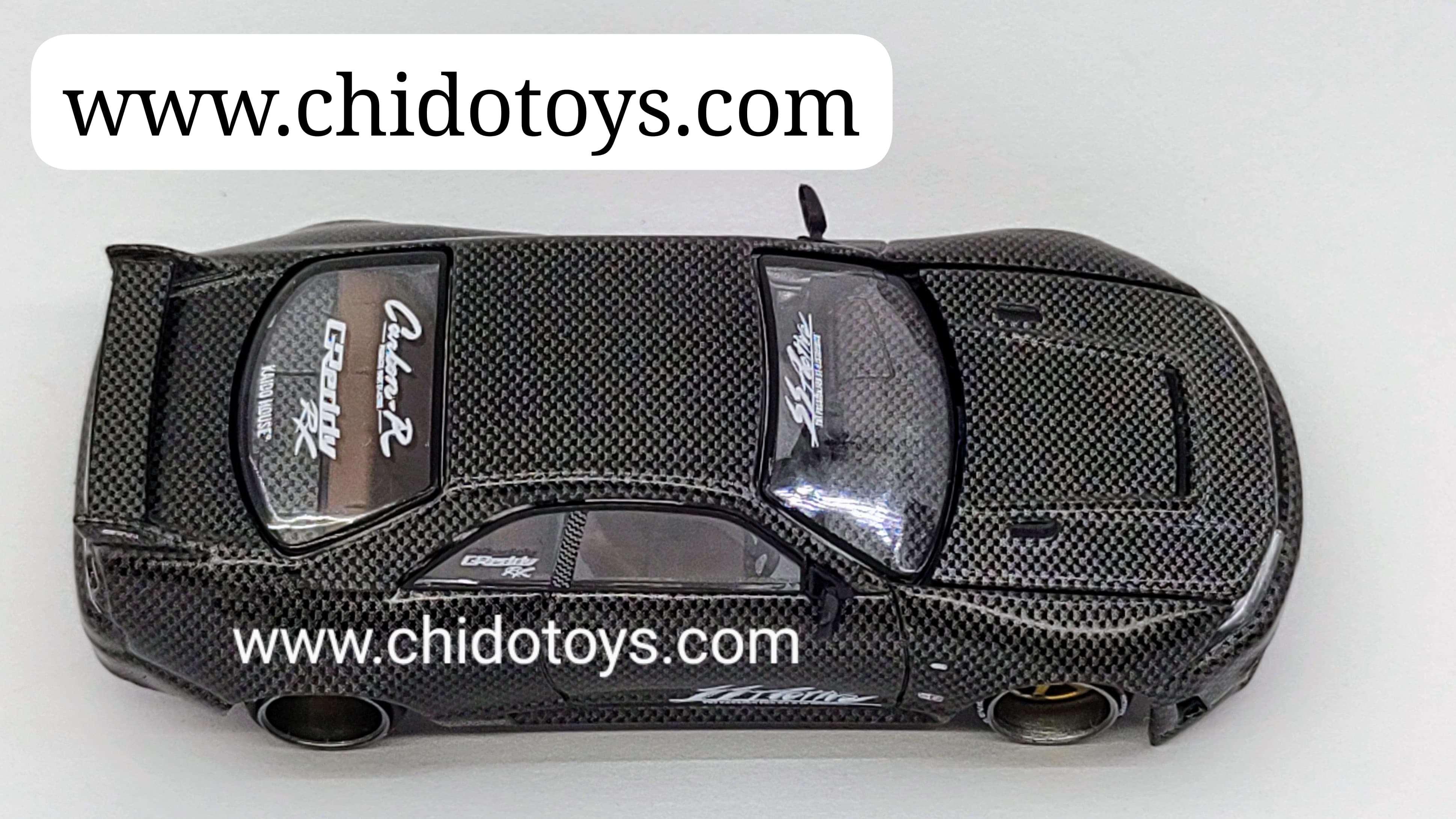 Auto a escala marca Kaido House, Modelo Nissan Skyline GT - R (R33) Active Carbon V1 - Chido Toys