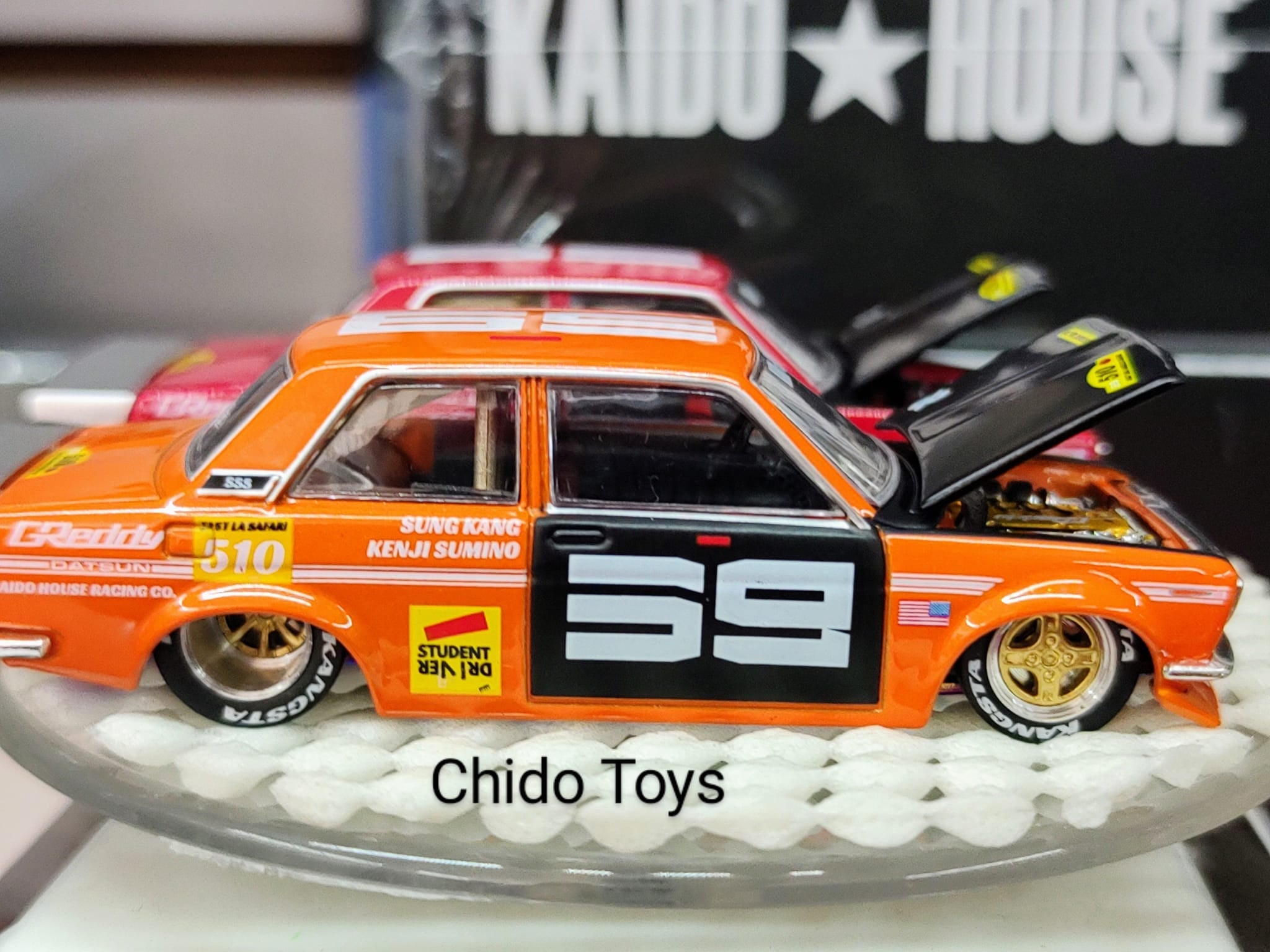 Auto a escala marca Mini Gt Kaido House, edad 14+, Color Naranja - Chido Toys