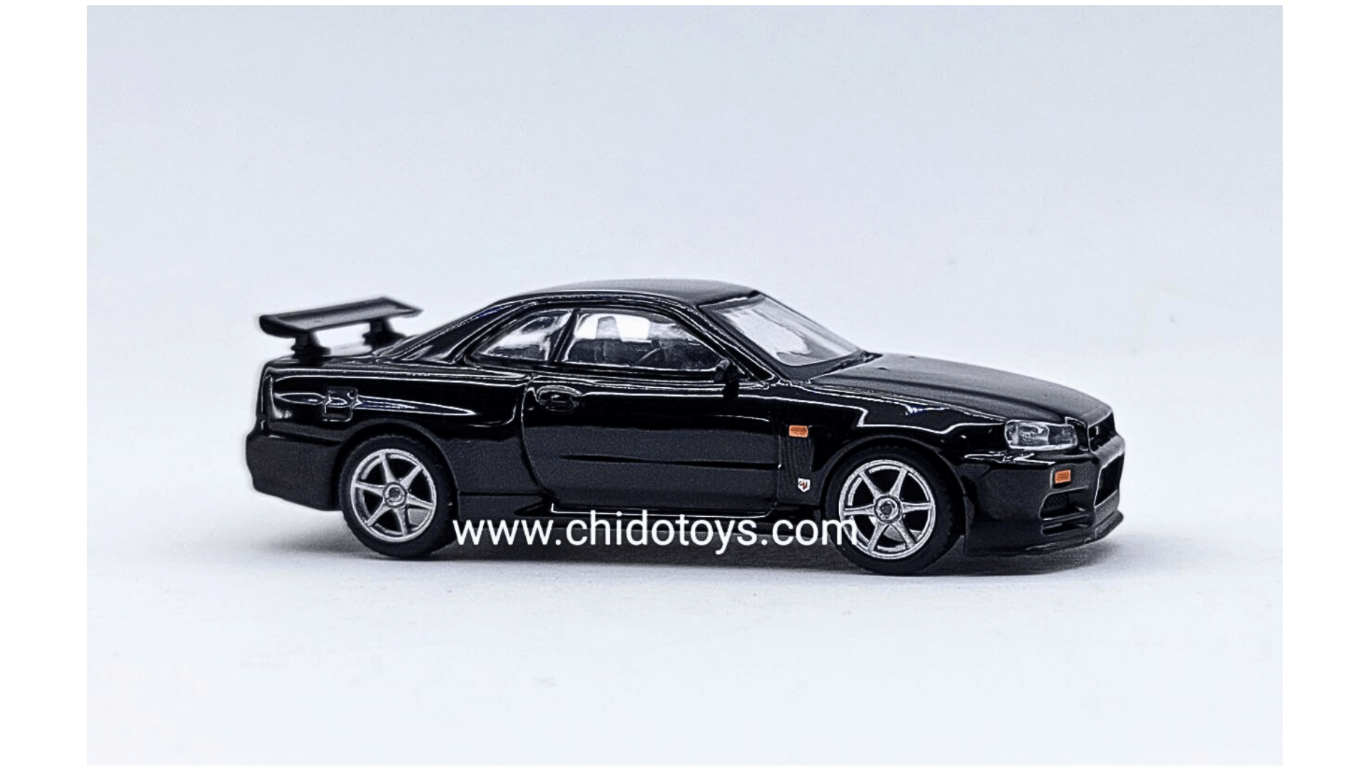 Auto a escala marca Mini GT, Modelo Nissan Skyline GT - R Black Pearl - Chido Toys