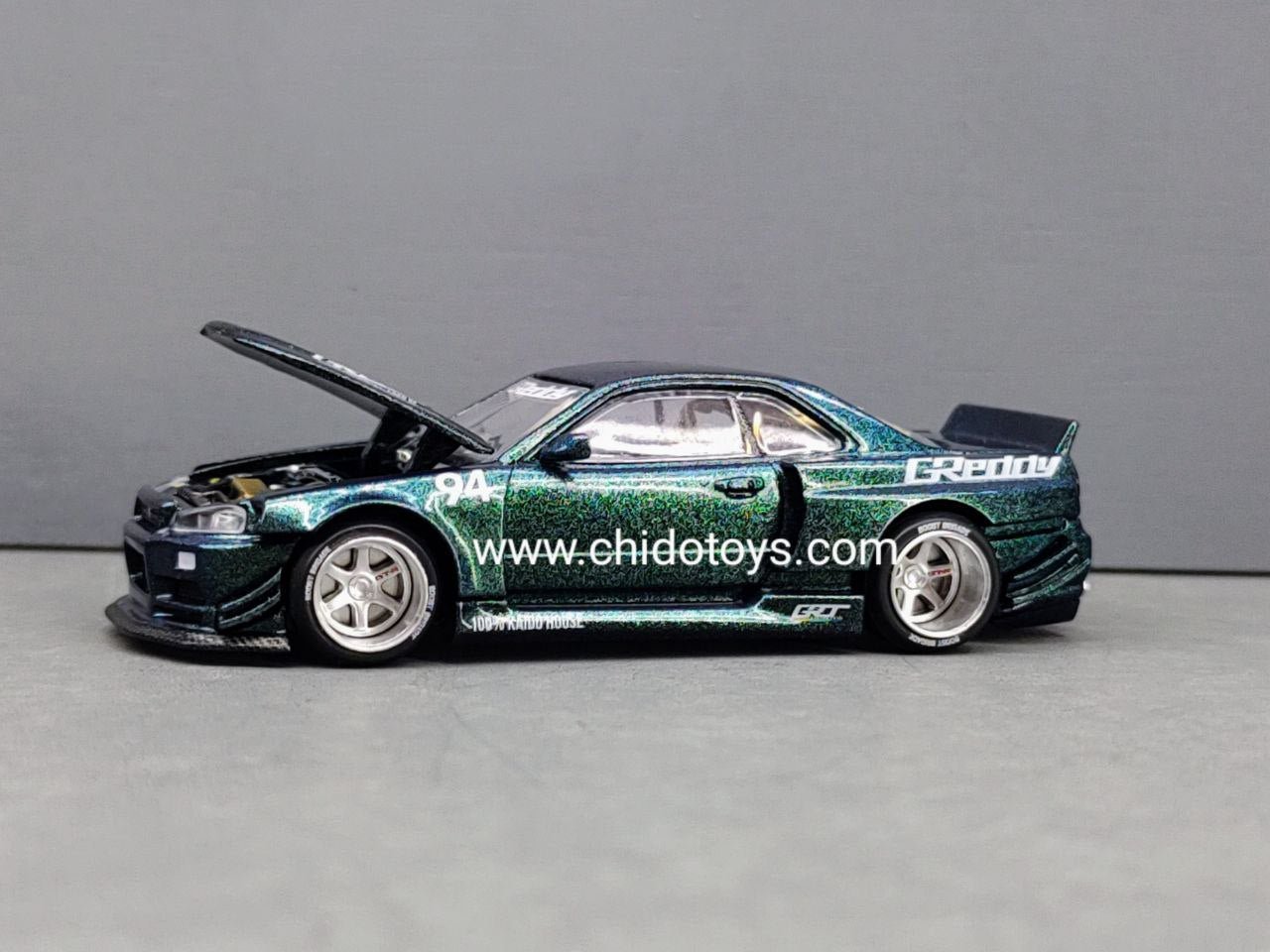 Auto a escala marca Mini GT, Modelo Nissan Skyline GT - R (R34) Kaido Works GReddy - Chido Toys