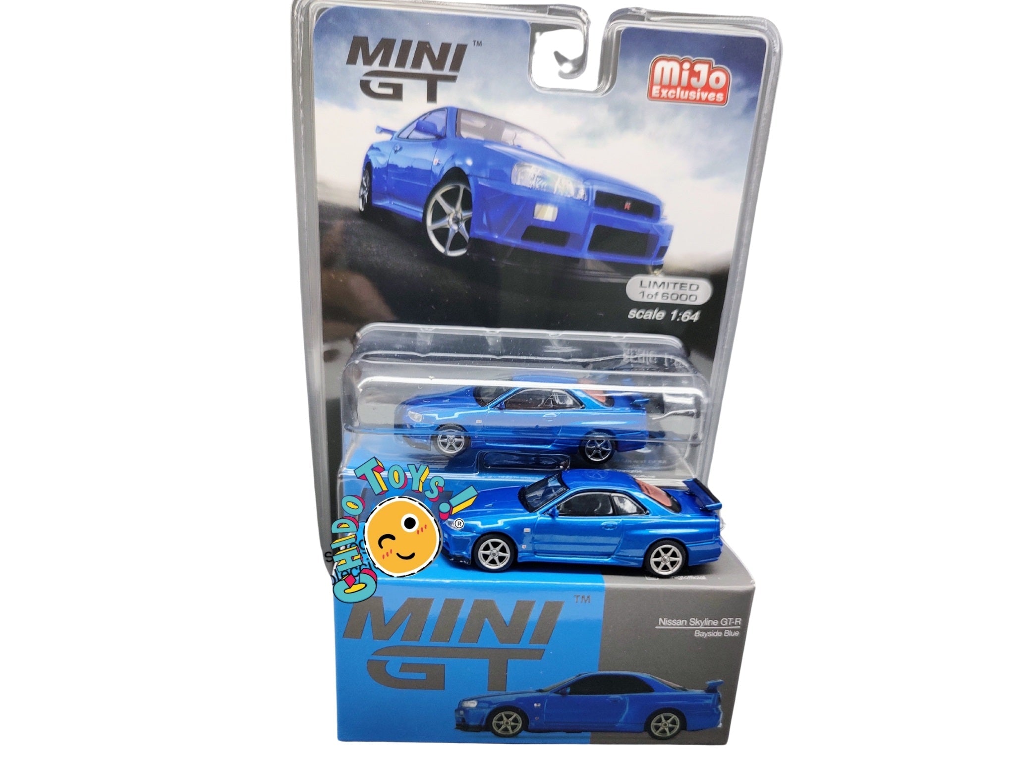 Auto a escala marca Mini GT Nissan Skyline GT - R (R34) V - Spec II Bayside - Chido Toys