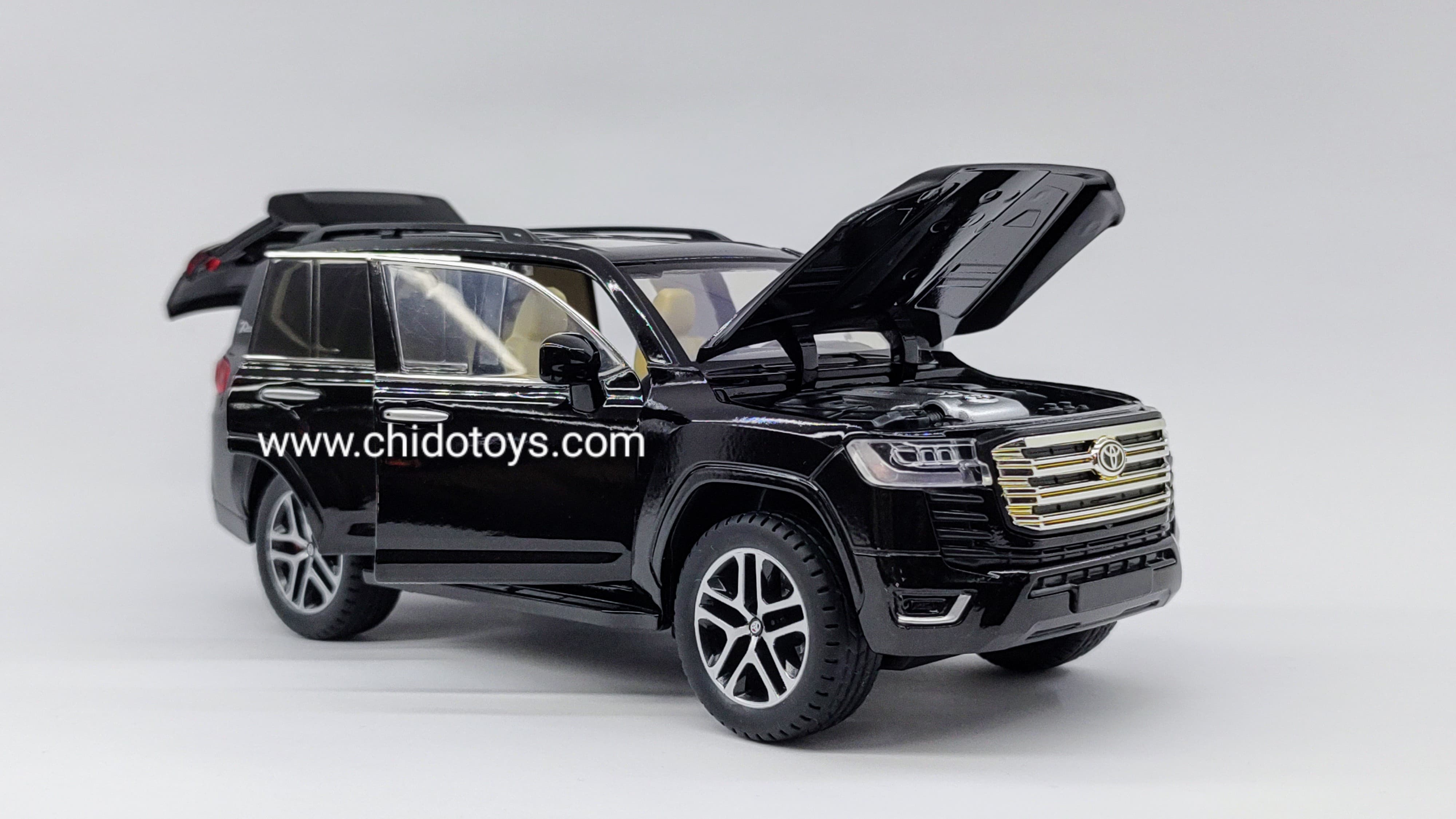 Auto a escala Toyota Land Cruiser 2023 (negro, blanco) - Chido Toys