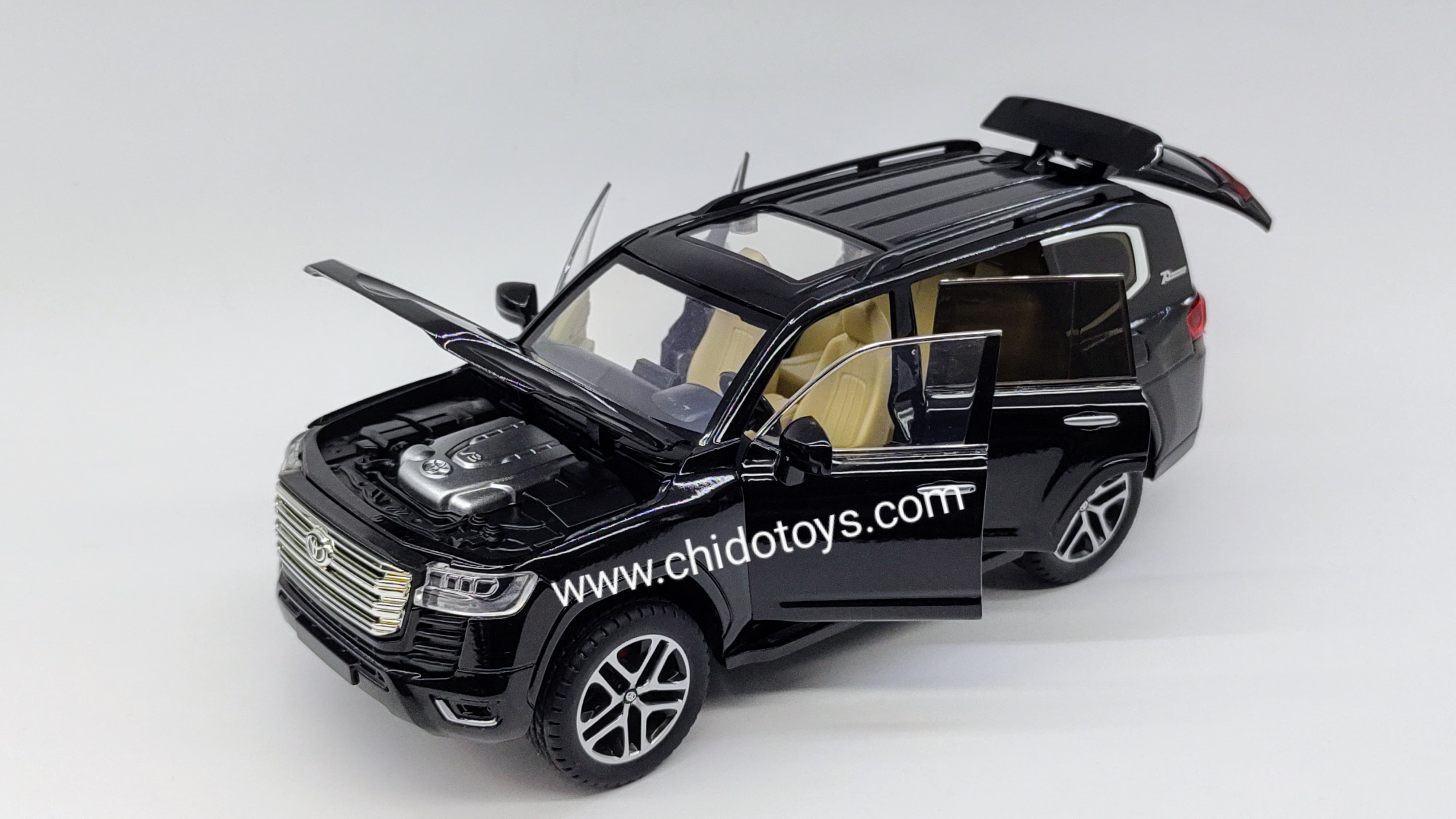 Auto a escala Toyota Land Cruiser 2023 (negro, blanco) - Chido Toys