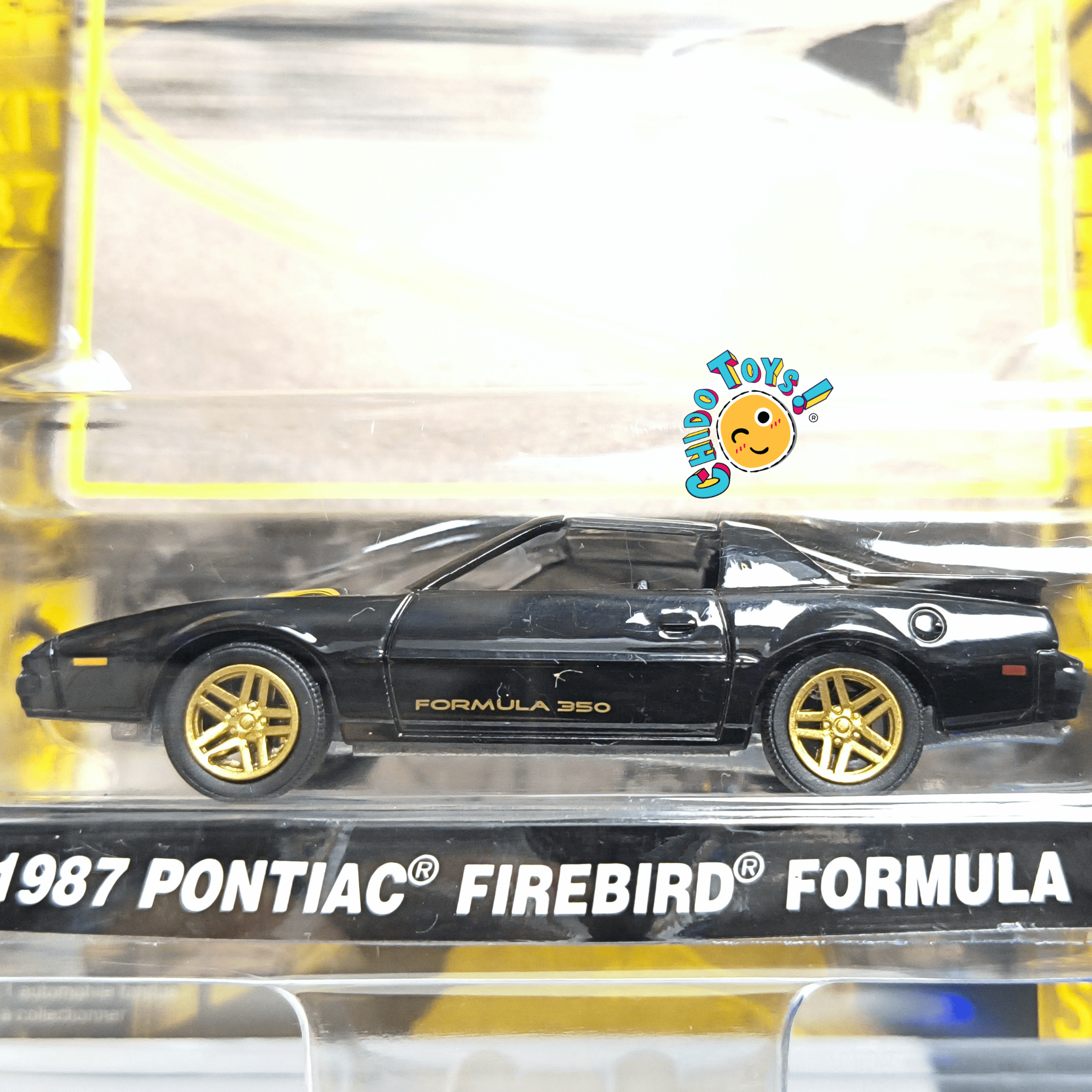 GreenLight Pontiac Firebird Formula 350 1987 County Roads 1:64 negro con rines dorados - Chido Toys