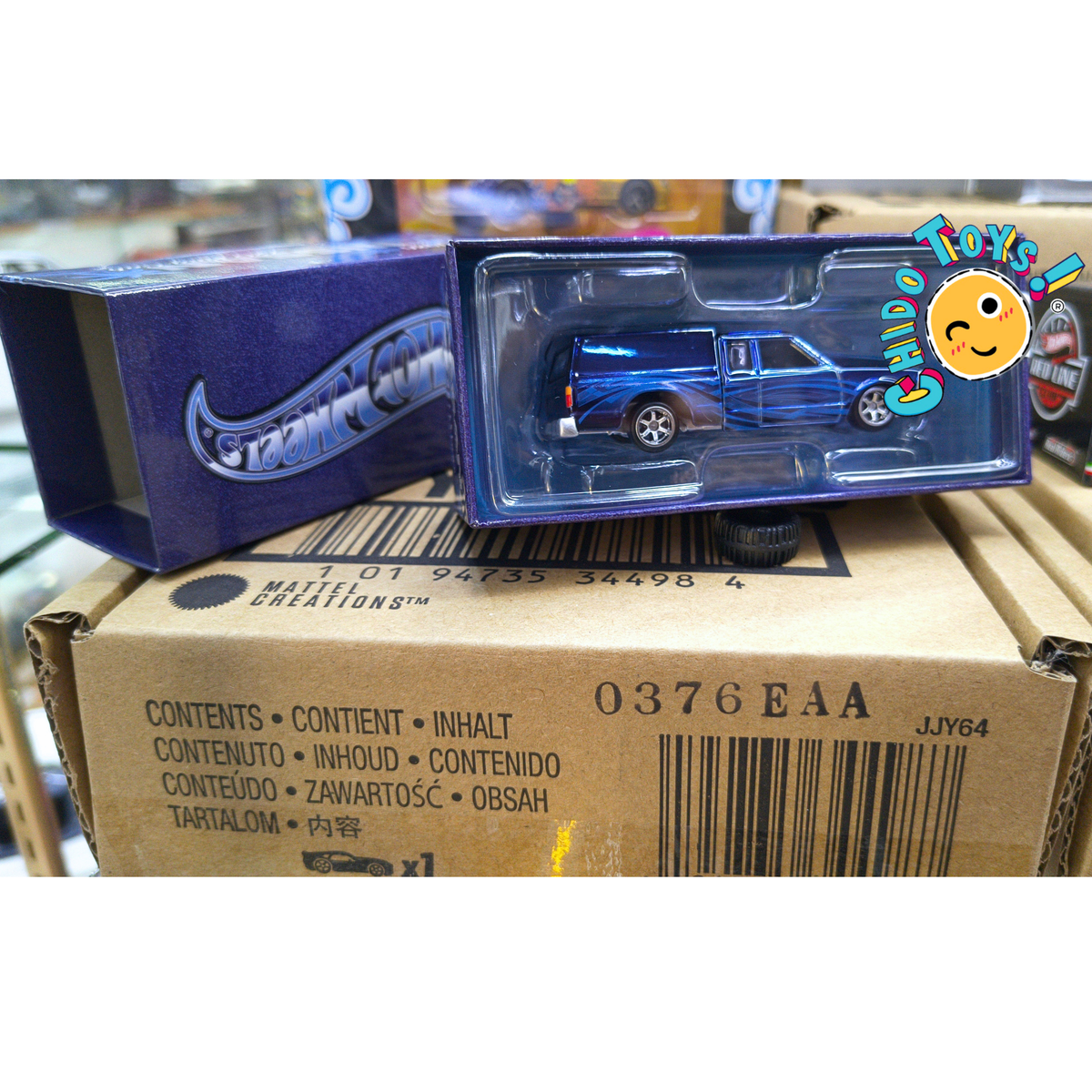Hot Wheels RLC 1986 Nissan 720 King Cab 1:64 Spectraflame Steel Blue con caja articulada - Chido Toys