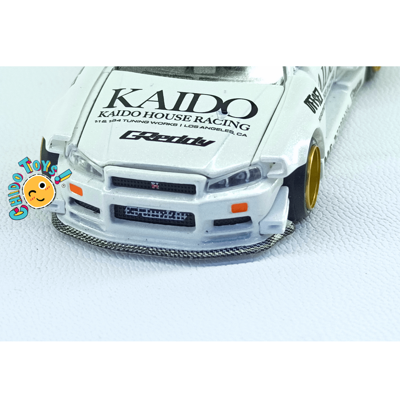 Kaido House 049 Nissan Skyline GT - R R34 White CHASE 1:64 | Cofre Abierto | Metal - Chido Toys
