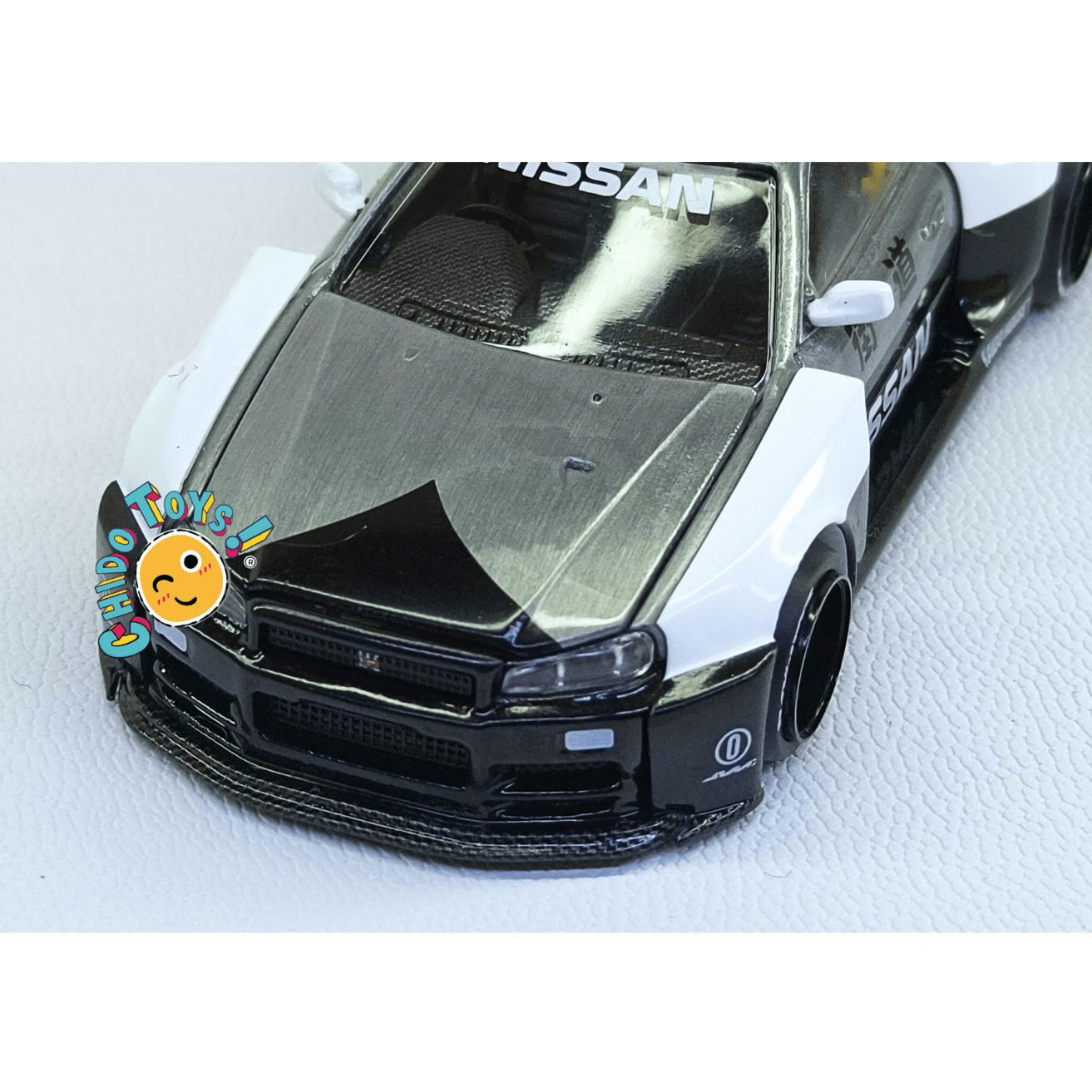 Nissan Skyline GT - R R34 Kaido Works V2 Aero Japan Police – Versión CHASE | Mini GT x Kaido House | 1:64 - Chido Toys