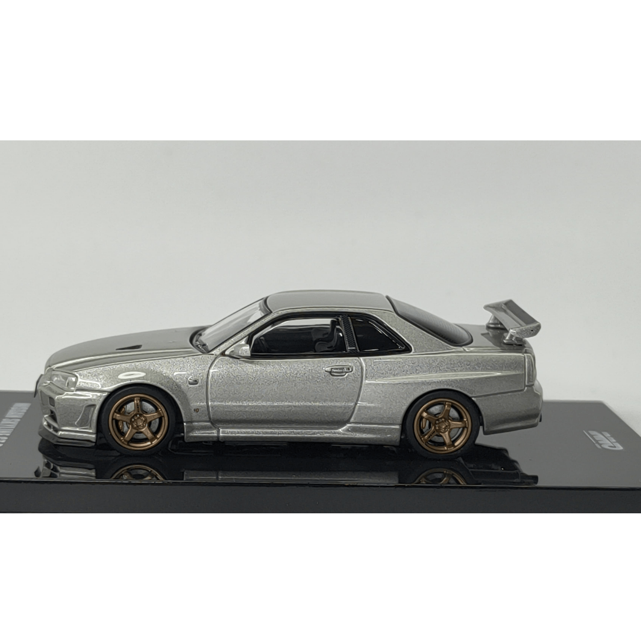 Nissan Skyline GT - R (R34) V - Spec II Plata – Inno64 1:64 - Chido Toys