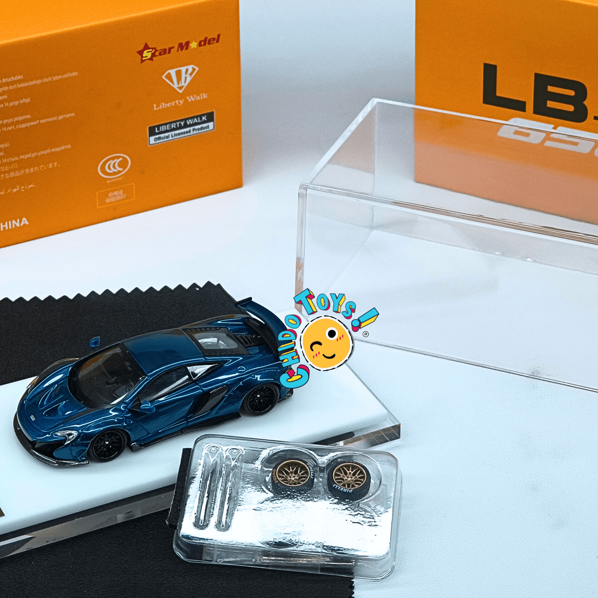 Star Model McLaren 650S Liberty Walk oficial 1:64 azul metálico con llantas adicionales - Chido Toys
