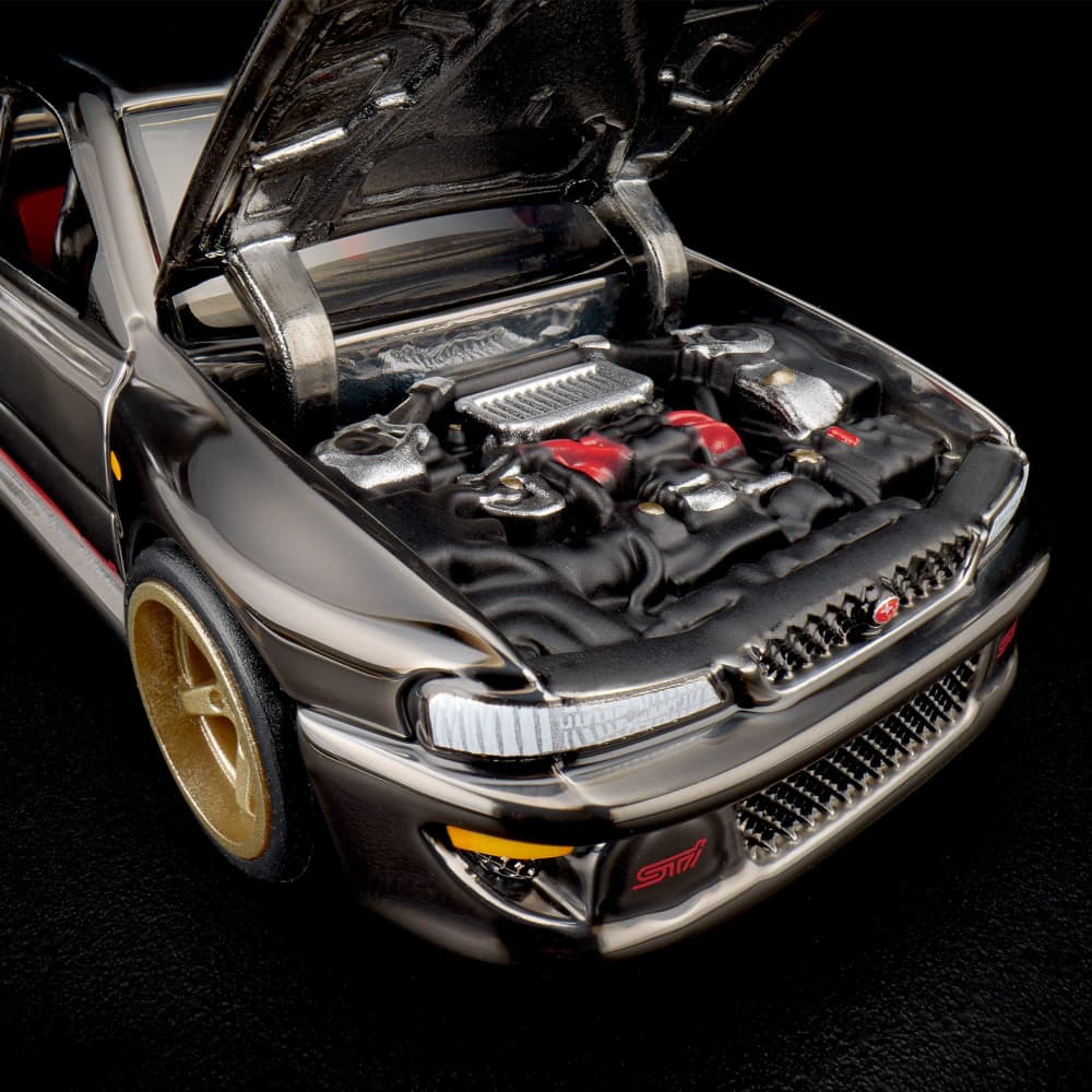 Hot Wheels RLC Subaru Impreza WRX STi 1998 1:64 Spectraflame Slate, Real Riders bronce y cofre abatible con motor detallado.